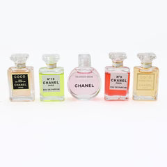 Five Chanel perfume bottles of different sizes on a white background at best price online in Pakistan