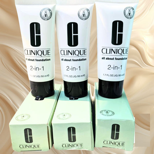 Three Clinique 2-in-1 foundation tubes with their boxes on a beige background at Maqbool store