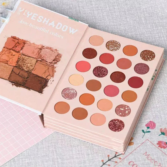 Makeup palettes with colorful shades on a textured surface