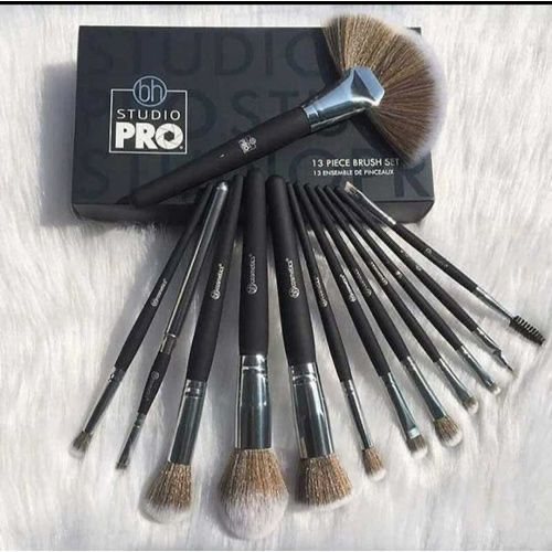 13-piece makeup brush set with 'Studio Pro' packaging on a light background
