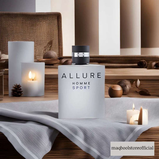 Allure Homme Sport perfume bottle on a table with candles and decorative items.