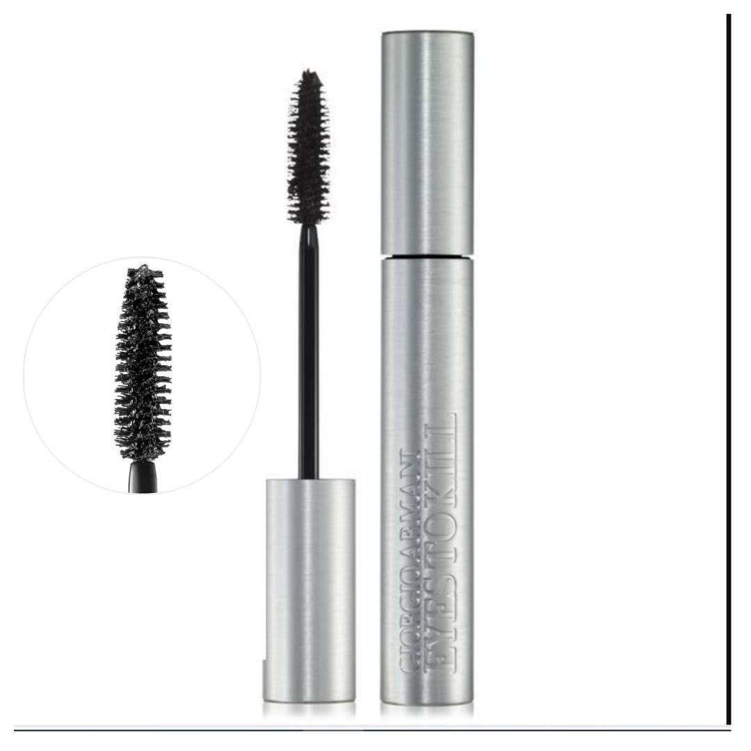 Mascara with silver tube and black brush on a white background