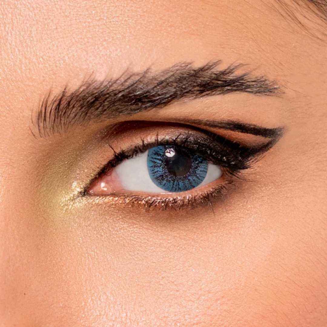 Close-up of a person's eye with Basic Aqua Blue Contact Lens