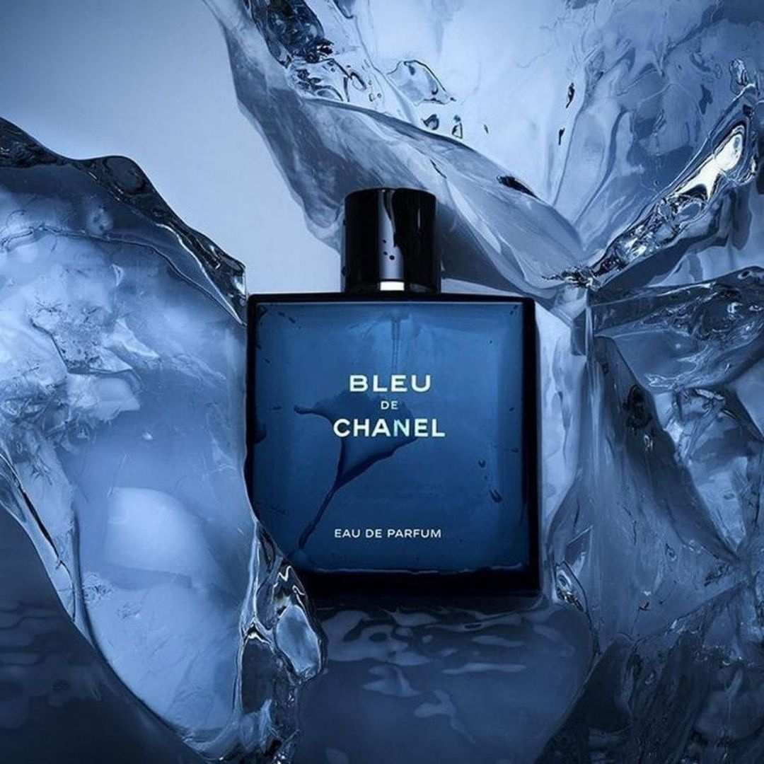 Bleu de Chanel perfume bottle surrounded by ice