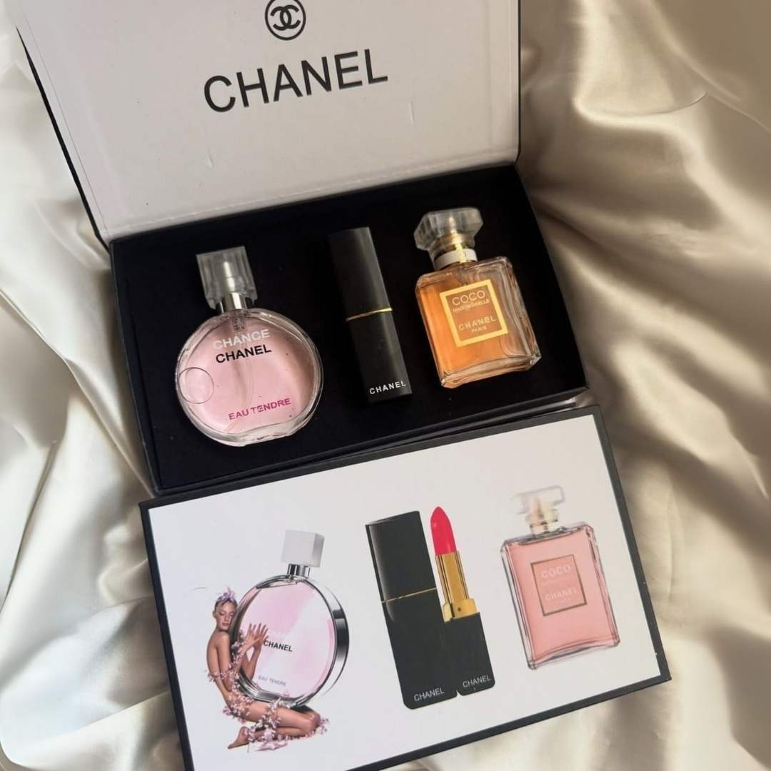 Chanel perfume set with bottles and a lipstick on a white background