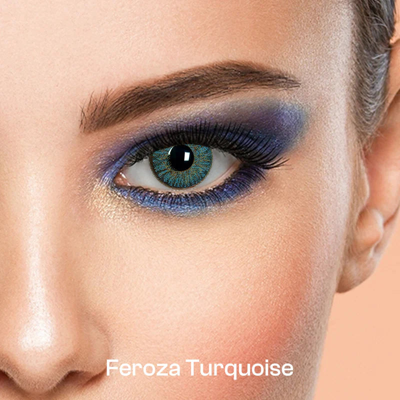 Close-up of a woman's eye wearing Feroza Turquoise contact lenses labeled 'Feroza Turquoise ultimate plus
