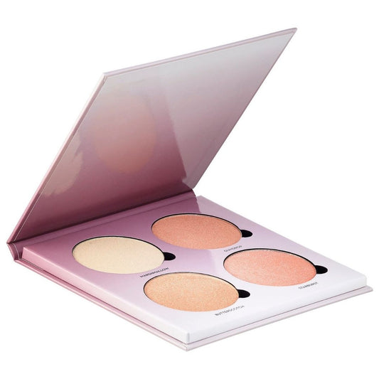 Makeup palette with four round compacts on a white background