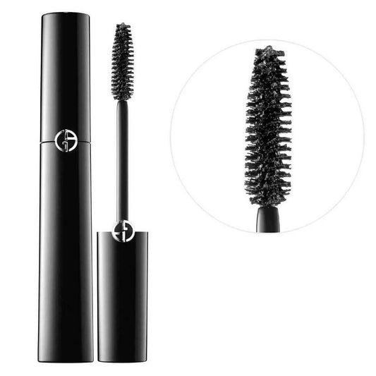 Black mascara with brush and close-up of bristles on a white background