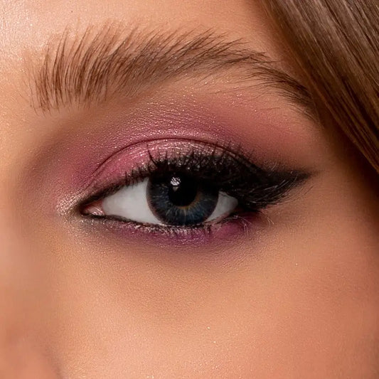 Close-up of a woman's eye with comfort NK Aqua Blue contact Lenses.