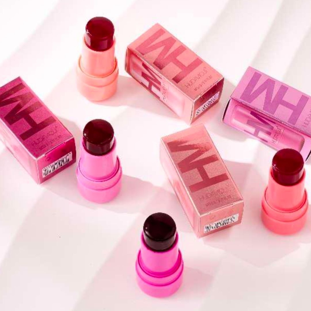Pink jelly tent lipsticks and boxes on a white background