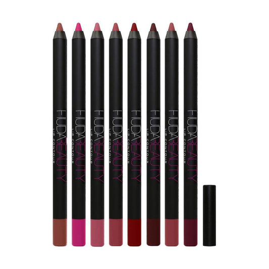 Set of Huda Beauty lip pencils with color swatches on a white background