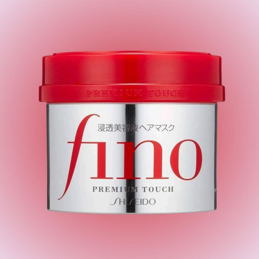 Shiseido fino Premium Touch hair mask jar with red lid on a pink background