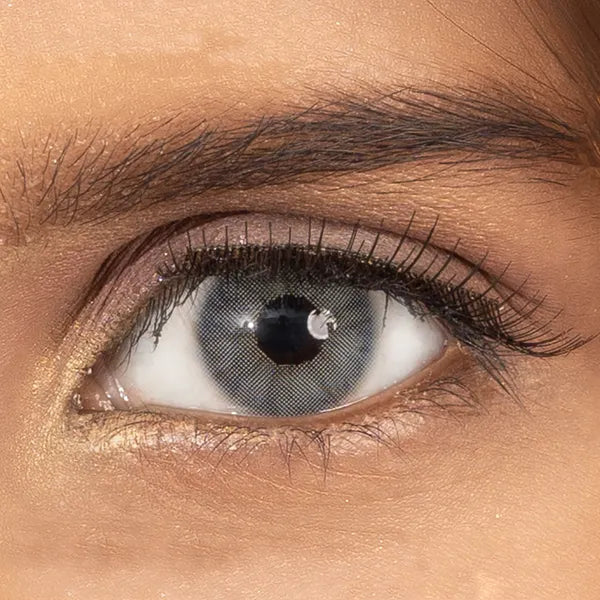 Close-up of a person's eye with a gray contact lens ULTIMATE PLUS CONTACT LENSES 