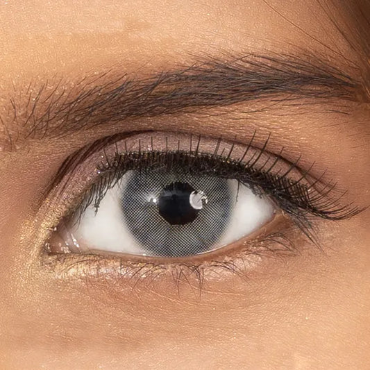 Close-up of a person's eye with a gray contact lens ULTIMATE PLUS CONTACT LENSES 