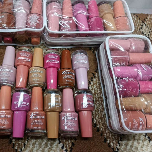 Collection of Xiancai nail polishes in various colors on a patterned surface.