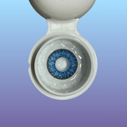 Blue contact lens in a white case on a gradient blue background at best price online sale in Pakistan