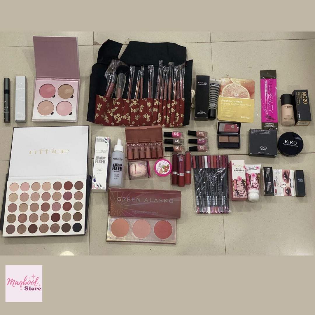 Collection of makeup products including palettes and brushes on a tiled floor.