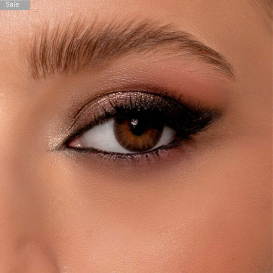 Close-up of a woman's eye with brown pretty contact lenses