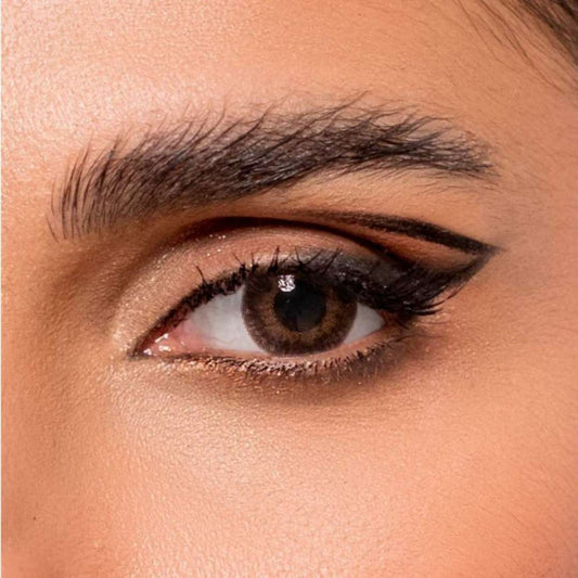 Close-up of a person's eye with  comfort contact lenses bio luk brown