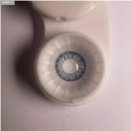 Close-up of a comfort contact pretty_lens blue_color in a case with a blurred background