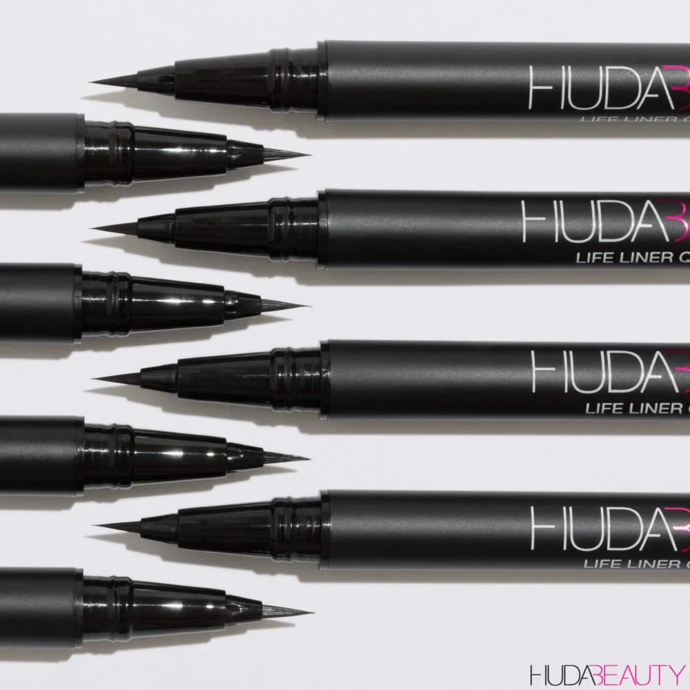 Multiple Huda Beauty life liner pens on a white background at best price online sale in Pakistan