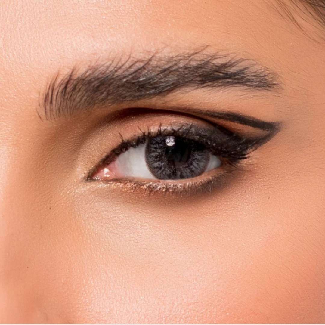 Close-up of a woman's eye with jewel_gray_lens