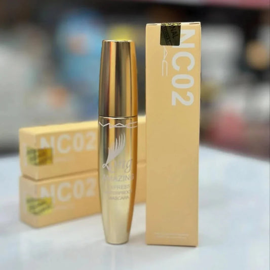 Gold mascara with packaging on a blurred background