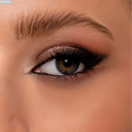 Close-up of a woman's eye with pretty blue lenses
