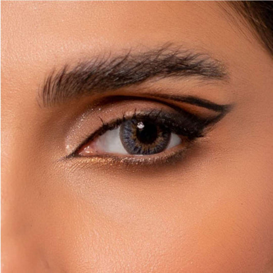 Close-up of a person's eye with rainbow grey contact lenses