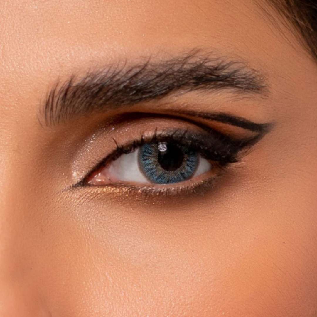 Close-up of a person's eye with rainbow_sky blue_comfort contact_lenses