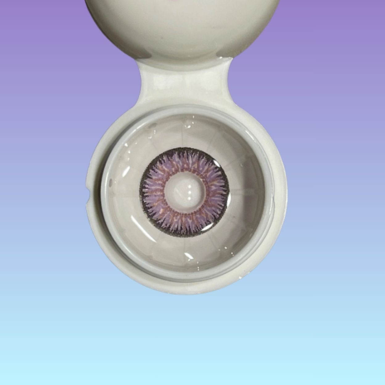 Close-up of a contact lens in a container with a gradient background