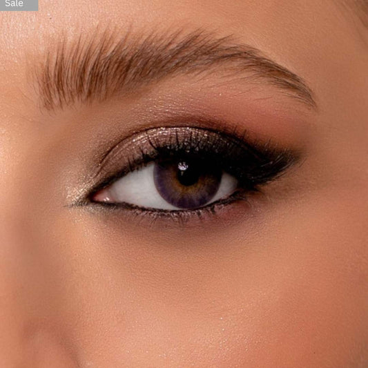 Close-up of a person's eye with violet pretty lens